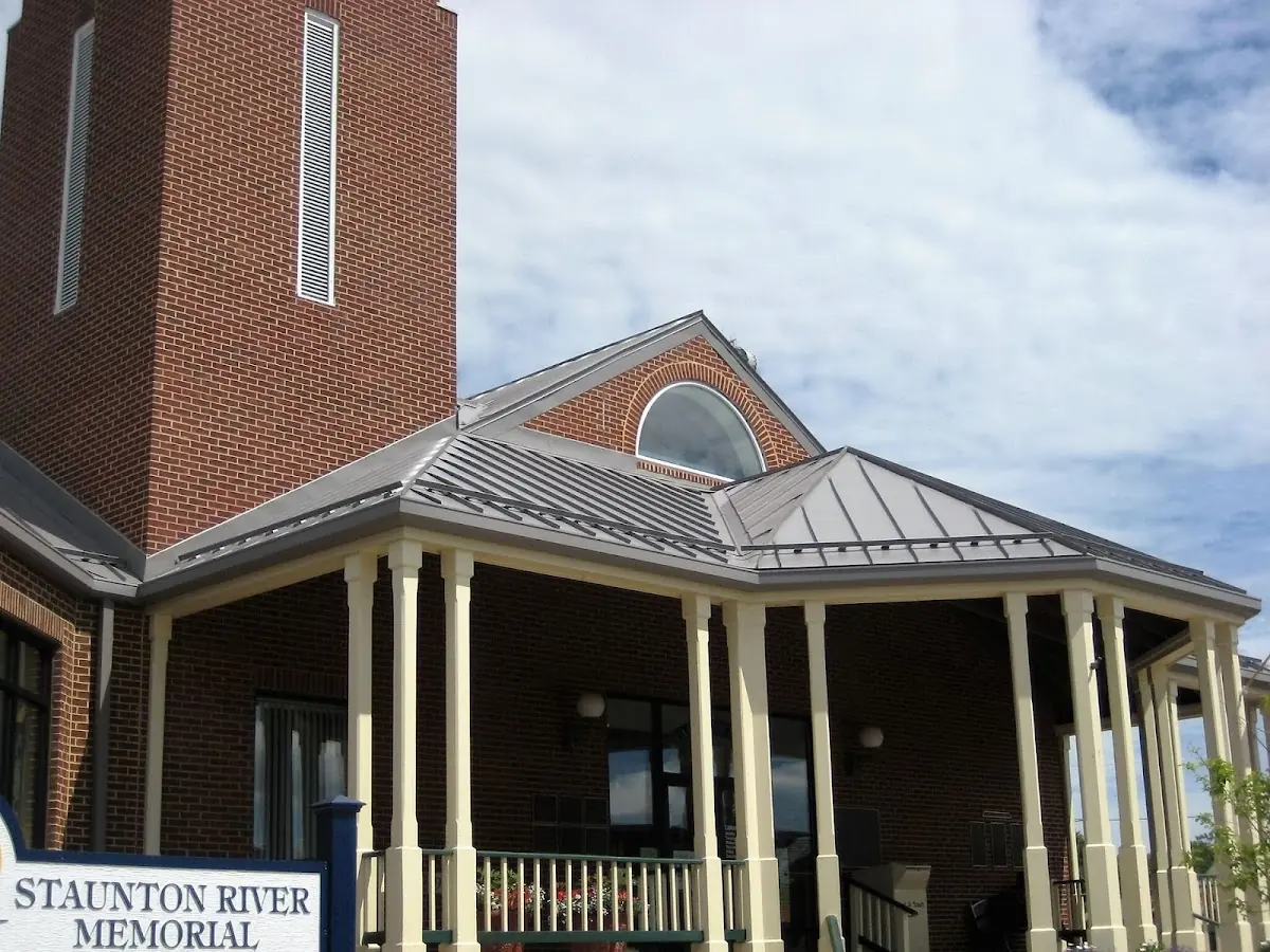 Skilled roofing craftsmen working on a residential roof in Forrest City
